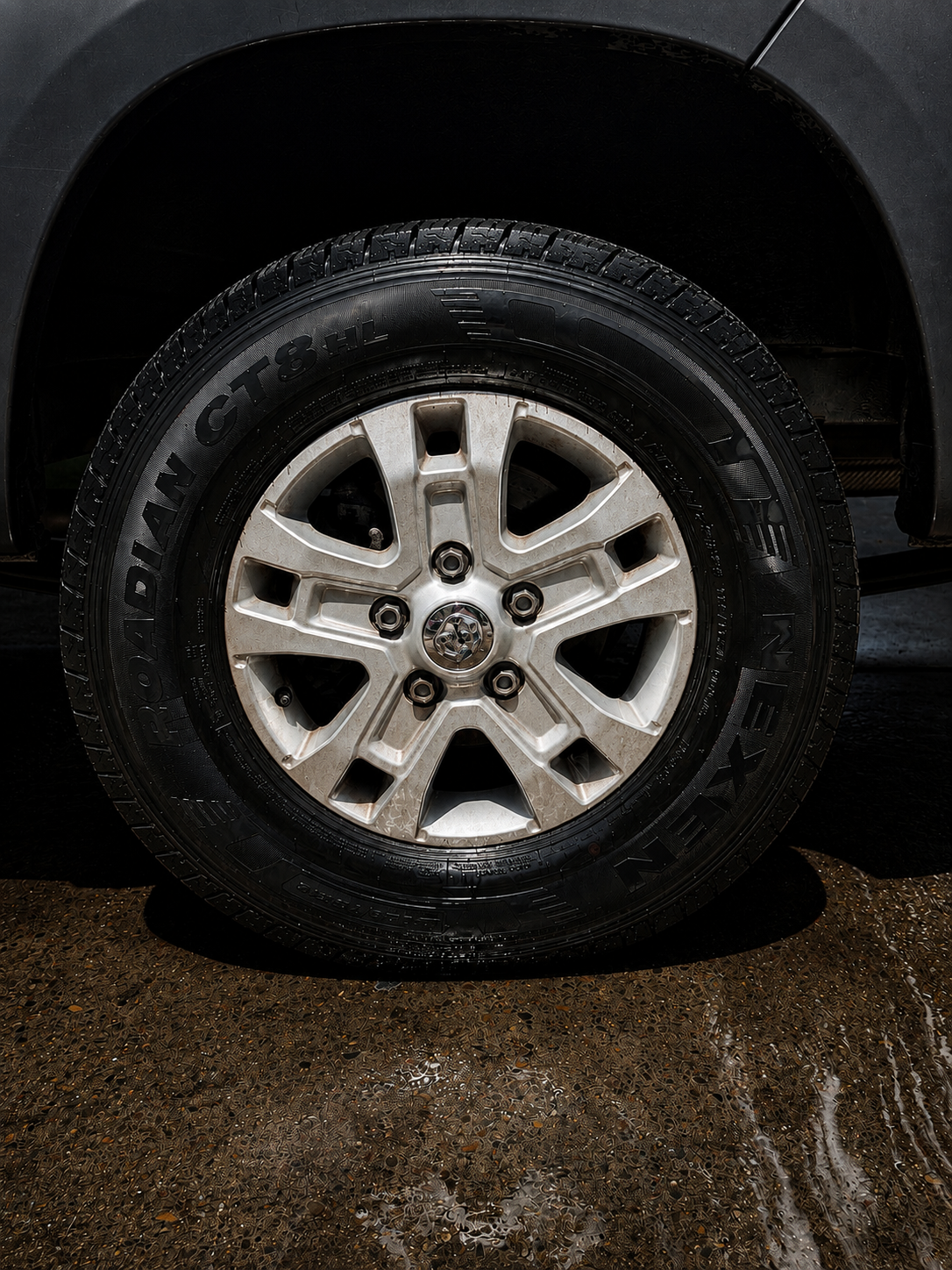 Truck wheel coated in brake dust and road film before the KingWash detail