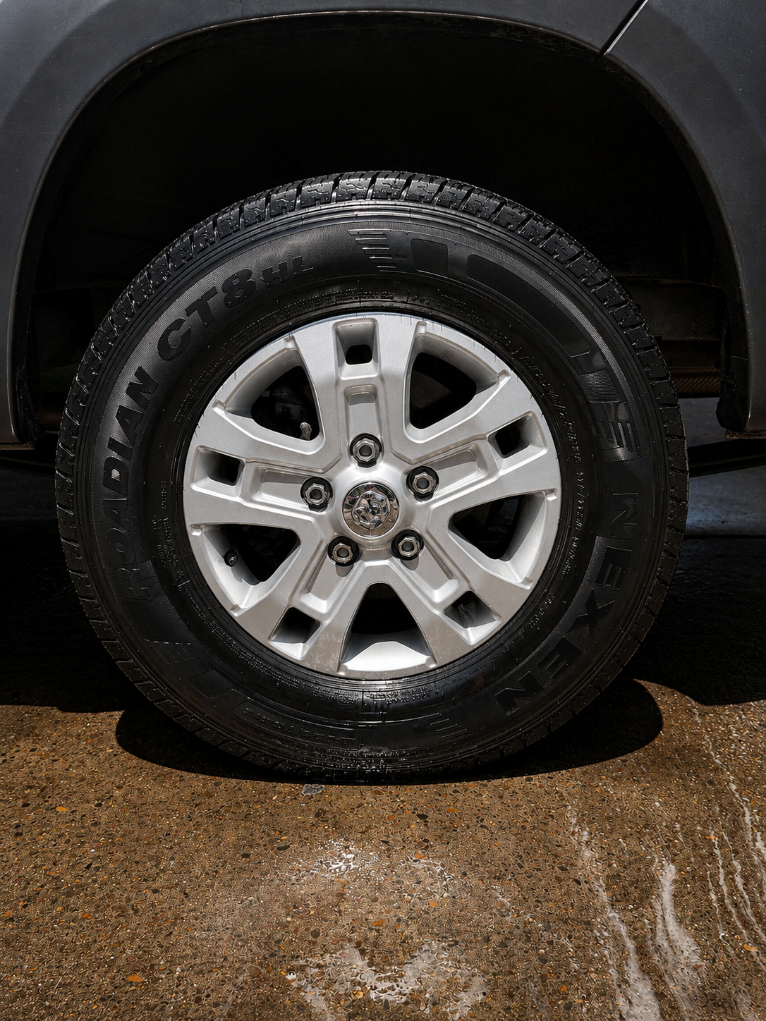 The same truck wheel cleaned and the tire dressed after the KingWash detail